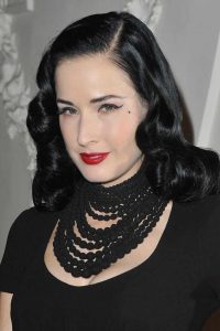dita von teese wearing a black necklace